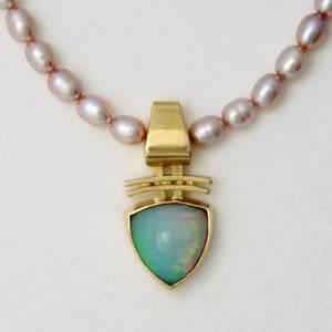 Necklace with Ethiopian Opal centerpiece and pink fresh-water Pearls